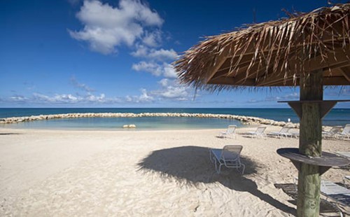 Lounge chair in the shade on the beach